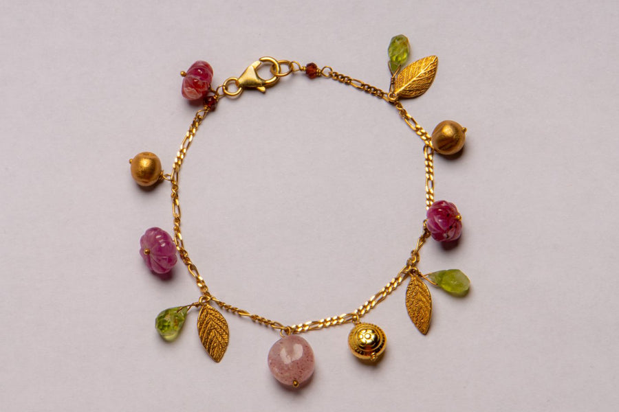 Handcrafted Gold Bracelet with Carved Stones and Leaves